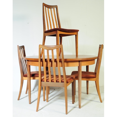 613 - G Plan - A mid 20th century G-Plan teak extending dining table and chairs. The table being of circul... 