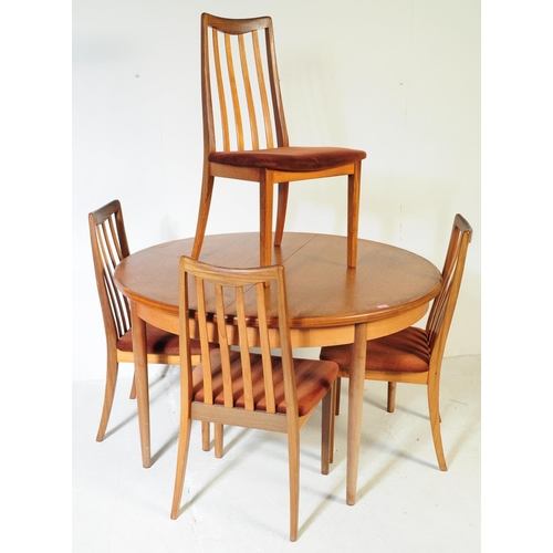 613 - G Plan - A mid 20th century G-Plan teak extending dining table and chairs. The table being of circul... 