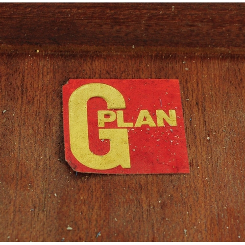 613 - G Plan - A mid 20th century G-Plan teak extending dining table and chairs. The table being of circul... 