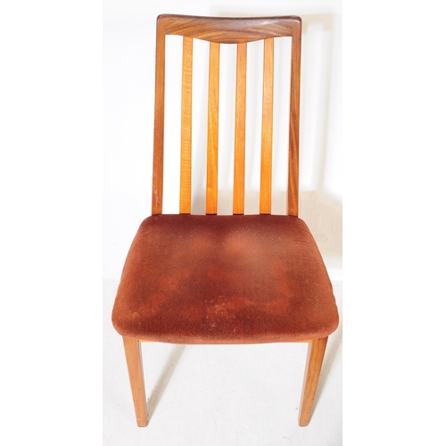 613 - G Plan - A mid 20th century G-Plan teak extending dining table and chairs. The table being of circul... 