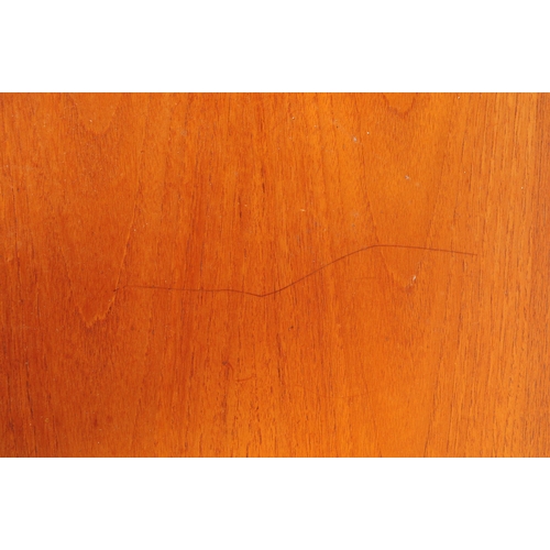 614 - British Modern Design - A mid 20th century teak coffee table. The table having central teak top flan... 