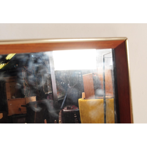 616 - British Modern Design - A mid century teak and flash worked gilt metal rectangular wall mirror. Cent... 