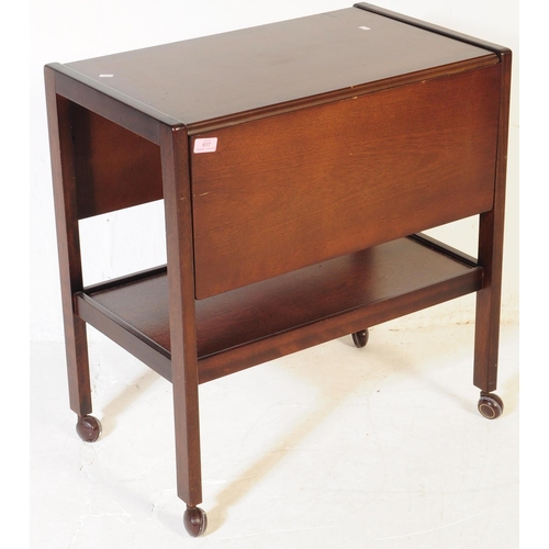 617 - BRITISH MODERN DESIGN - A mid century teak wood butlers hostess serving trolley. Drop leaves to the ... 