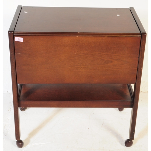 617 - BRITISH MODERN DESIGN - A mid century teak wood butlers hostess serving trolley. Drop leaves to the ... 