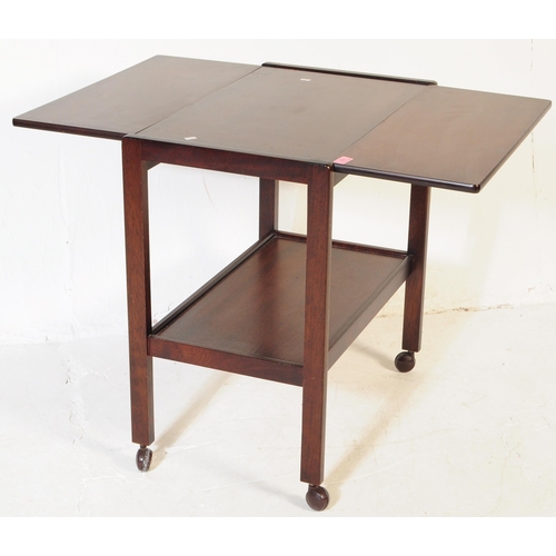 617 - BRITISH MODERN DESIGN - A mid century teak wood butlers hostess serving trolley. Drop leaves to the ... 