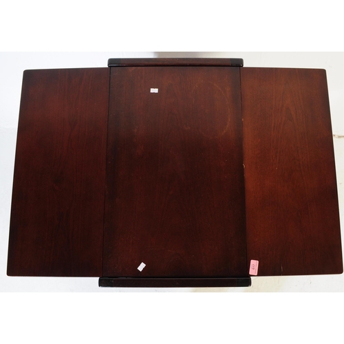 617 - BRITISH MODERN DESIGN - A mid century teak wood butlers hostess serving trolley. Drop leaves to the ... 