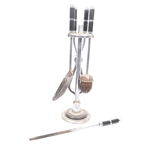 618 - A 1930's Art Deco chrome fireside suite / companion set comprising of hearth brush, fire poker, tong... 