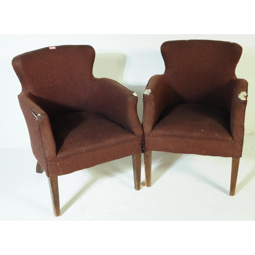 619 - British Modern Design - A pair of mid century woollen upholstered armchairs. The chairs being raised... 
