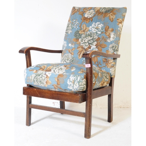620 - A 1940s bentwood Art Deco fireside armchair. Raised on squared legs with chintz upholstered seat and... 