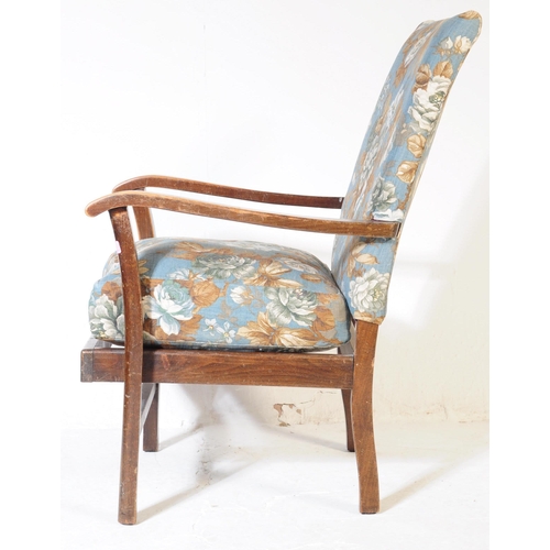 620 - A 1940s bentwood Art Deco fireside armchair. Raised on squared legs with chintz upholstered seat and... 