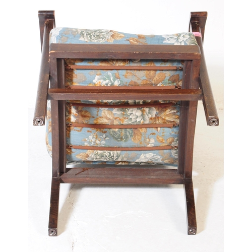 620 - A 1940s bentwood Art Deco fireside armchair. Raised on squared legs with chintz upholstered seat and... 