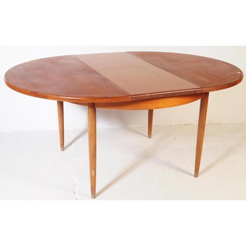 630 - G Plan Furniture - A retro mid 20th century teak dining table with four dining chairs. The table of ... 