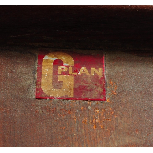 630 - G Plan Furniture - A retro mid 20th century teak dining table with four dining chairs. The table of ... 