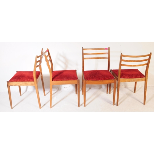 630 - G Plan Furniture - A retro mid 20th century teak dining table with four dining chairs. The table of ... 