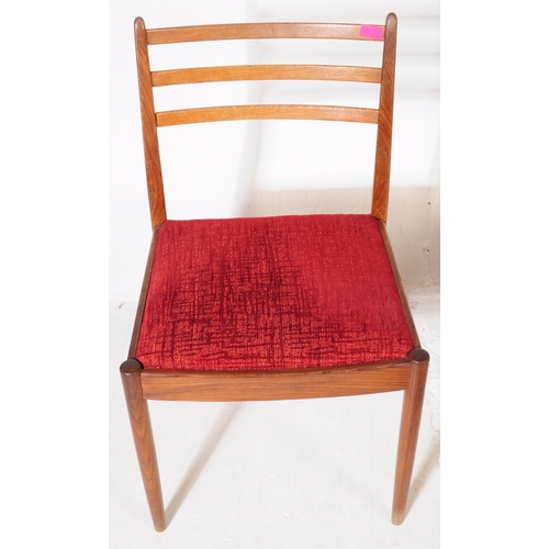 630 - G Plan Furniture - A retro mid 20th century teak dining table with four dining chairs. The table of ... 