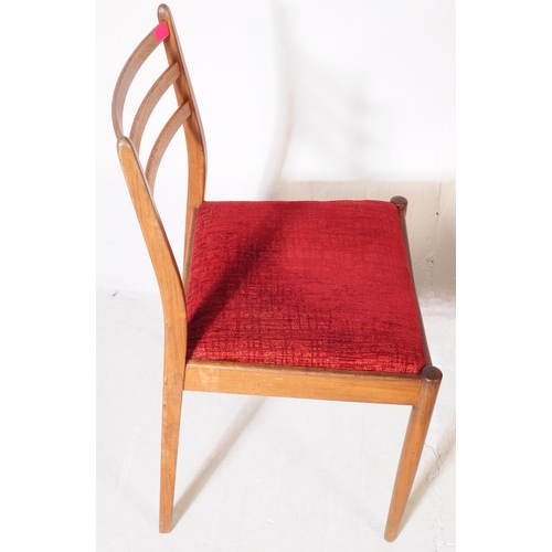 630 - G Plan Furniture - A retro mid 20th century teak dining table with four dining chairs. The table of ... 