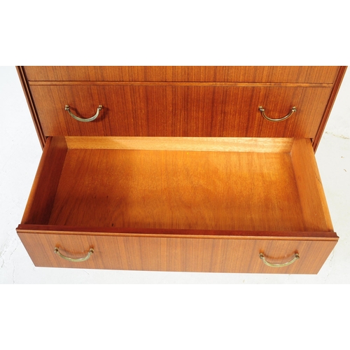 631 - Meredew Furniture - Mid 20th century teak chest of drawers. Rectangular form with a bank of five ful... 