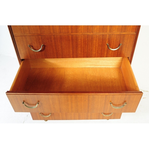 631 - Meredew Furniture - Mid 20th century teak chest of drawers. Rectangular form with a bank of five ful... 
