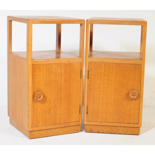 632 - A pair of retro vintage late 20th century plywood bedside cabinets having open upper, above cupboard... 