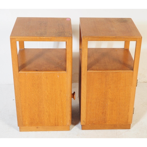 632 - A pair of retro vintage late 20th century plywood bedside cabinets having open upper, above cupboard... 
