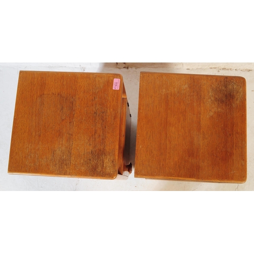 632 - A pair of retro vintage late 20th century plywood bedside cabinets having open upper, above cupboard... 