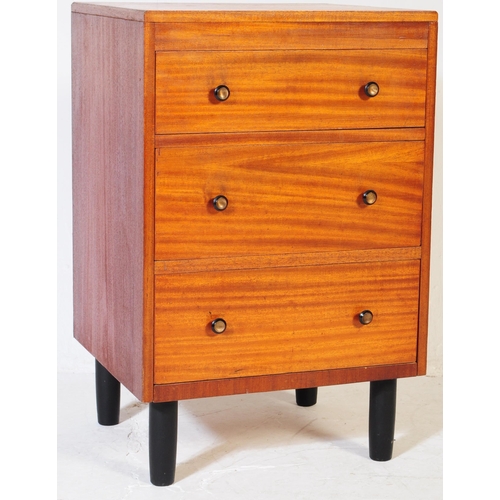 634 - A mid 20th century teak chest of drawers. Of rectangular form with a bank of three drawers. Raised o... 