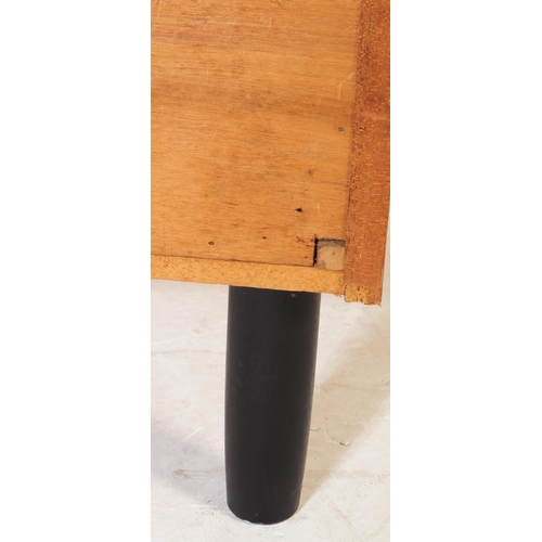 634 - A mid 20th century teak chest of drawers. Of rectangular form with a bank of three drawers. Raised o... 