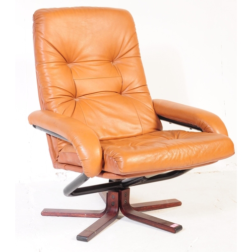 637 - A vintage tan PVC leather stress-less style recliner swivel chair in the manner of Ekornes. The armc... 