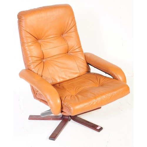 637 - A vintage tan PVC leather stress-less style recliner swivel chair in the manner of Ekornes. The armc... 