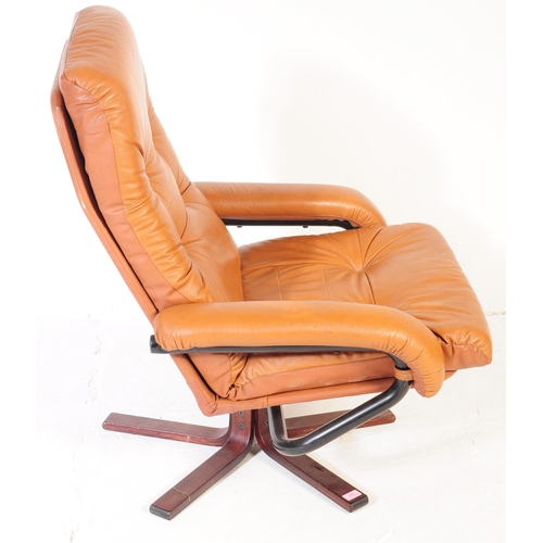 637 - A vintage tan PVC leather stress-less style recliner swivel chair in the manner of Ekornes. The armc... 