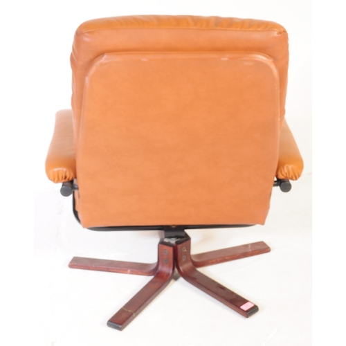 637 - A vintage tan PVC leather stress-less style recliner swivel chair in the manner of Ekornes. The armc... 