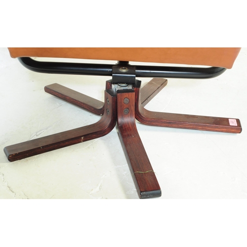 637 - A vintage tan PVC leather stress-less style recliner swivel chair in the manner of Ekornes. The armc... 