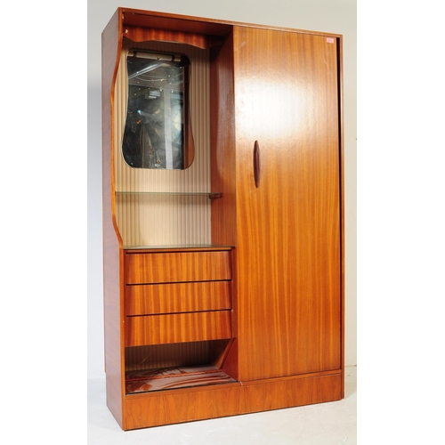 641 - A retro vintage mid century 1950s teak wood lobby wardrobe cupboard compactum by Hubbi Robe having a... 