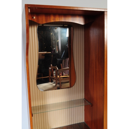 641 - A retro vintage mid century 1950s teak wood lobby wardrobe cupboard compactum by Hubbi Robe having a... 