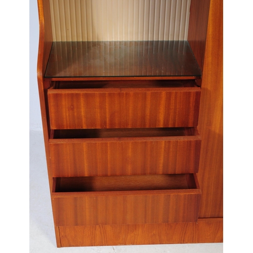 641 - A retro vintage mid century 1950s teak wood lobby wardrobe cupboard compactum by Hubbi Robe having a... 