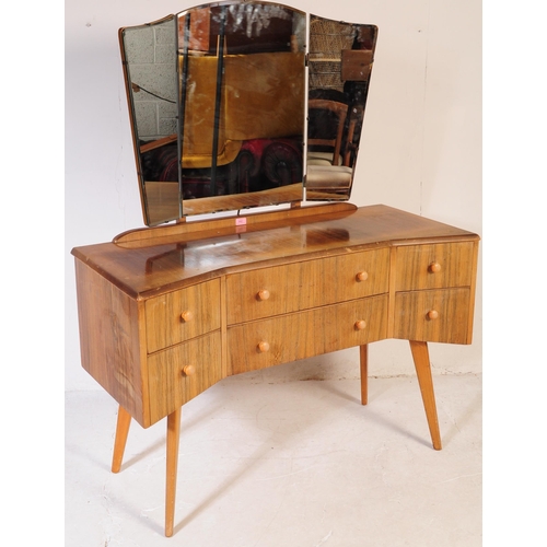 642 - A mid century bleached mahogany dressing table and stool in the manner of Wrighton Furniture. Raised... 