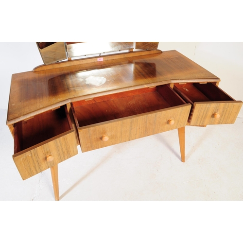 642 - A mid century bleached mahogany dressing table and stool in the manner of Wrighton Furniture. Raised... 