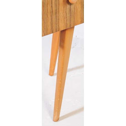 642 - A mid century bleached mahogany dressing table and stool in the manner of Wrighton Furniture. Raised... 