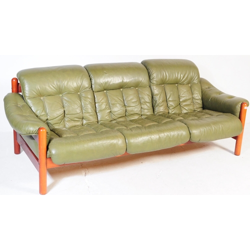 643 - A vintage mid-century 3 seater sofa in green leather and mahogany in the style of Jean Gillon. Green... 