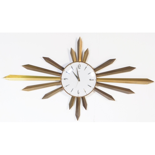 644 - An early vintage mid 20th century 1960's Metamec sunburst / star burst wall clock. The brass clock h... 