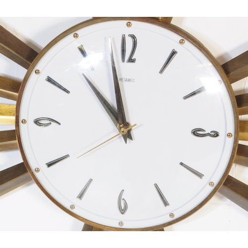644 - An early vintage mid 20th century 1960's Metamec sunburst / star burst wall clock. The brass clock h... 