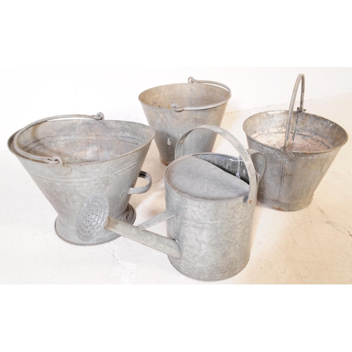 646 - An assortment of four 20th century industrial style galvanised metal buckets and watering can. Each ... 