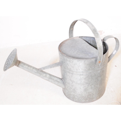 646 - An assortment of four 20th century industrial style galvanised metal buckets and watering can. Each ... 