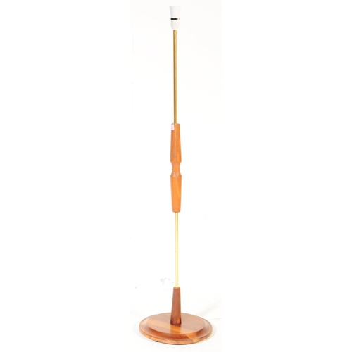 647 - A retro mid 20th century Danish inspired brass and teak floor standing standard lamp. The lamp havin... 