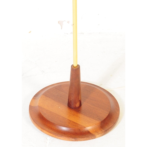 647 - A retro mid 20th century Danish inspired brass and teak floor standing standard lamp. The lamp havin... 