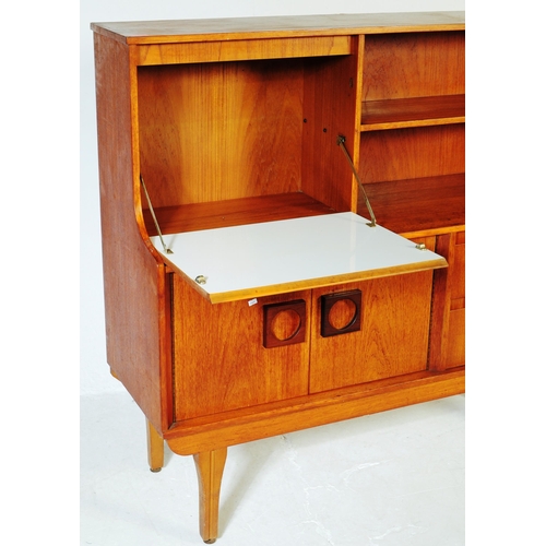 651 - Elliotts of Newbury - A mid 20th century retro teak higboard / sideboard. Having a pull down door ca... 