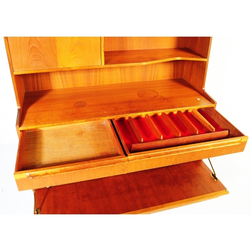 652 - McIntosh - Mid 20th century circa 19070s teak highboard sideboard. Having a configuration of shelves... 