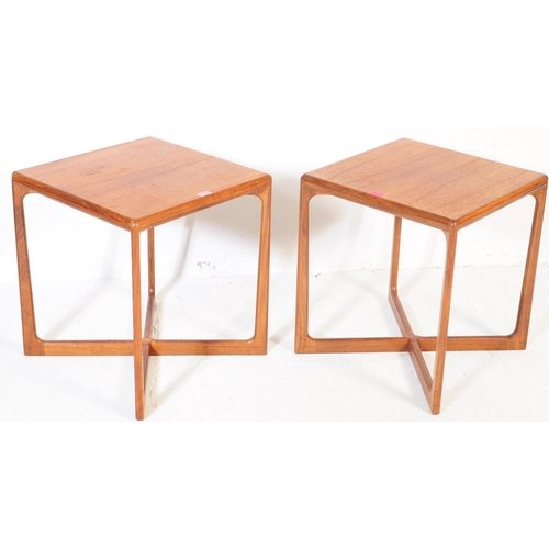 653 - A pair of mid 20th century Danish teak side / occasional tables. Of square form with rectangular sup... 