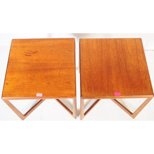 653 - A pair of mid 20th century Danish teak side / occasional tables. Of square form with rectangular sup... 