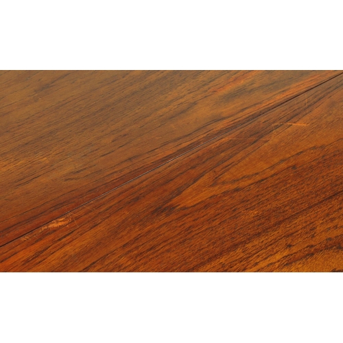 654 - British Modern Design - Mid 20th century teak drop leaf dining table with four chairs. The table of ... 